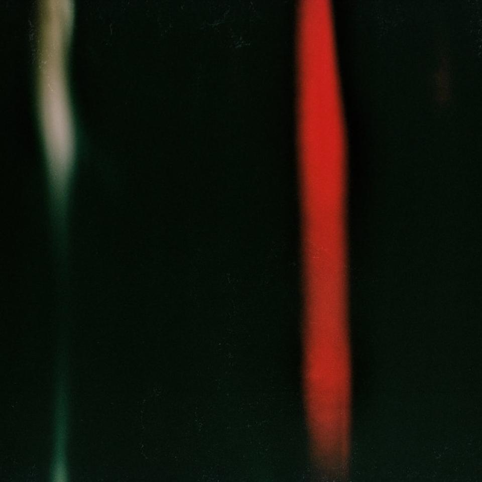 Cover artwork by Philipp Eden, black background with a whitish stripe to the left and a red stripe from up to down on the right