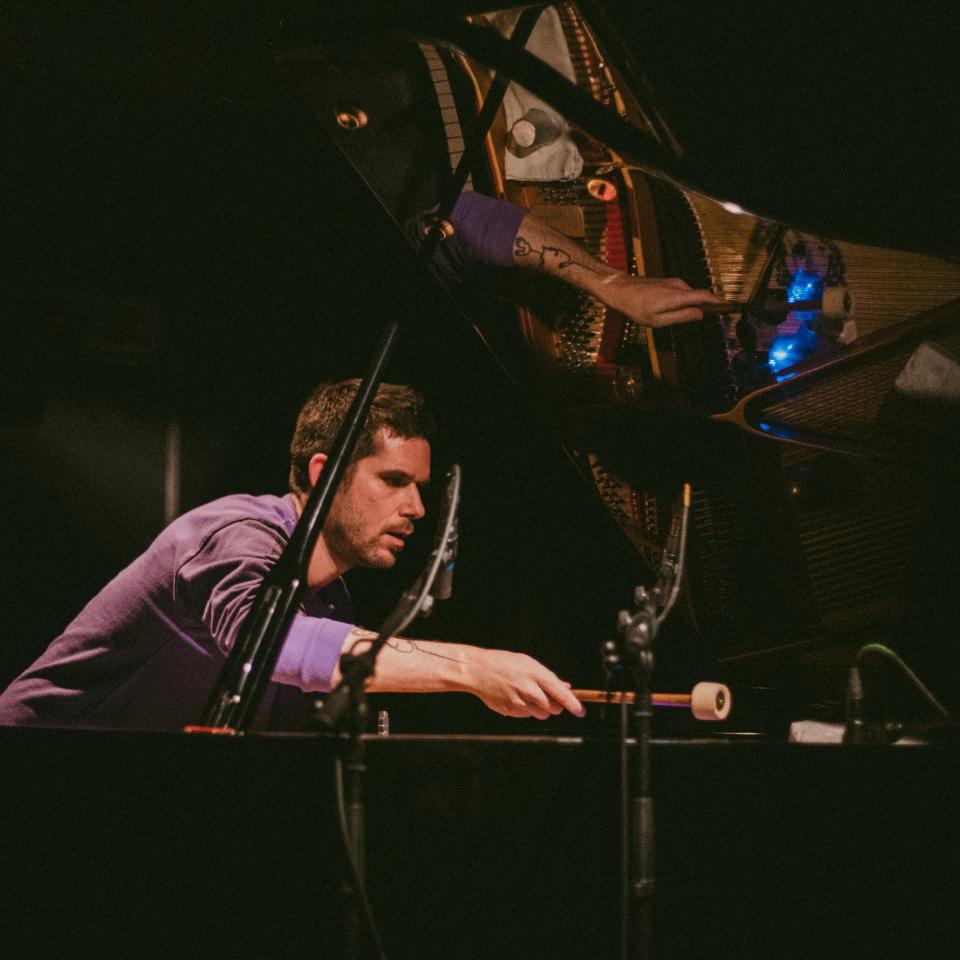 Playing the Piano with a mallet.