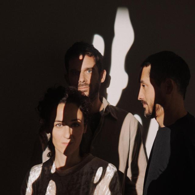 Another press image of the trio Eden Loriot Tantanozi, with shadows in their faces