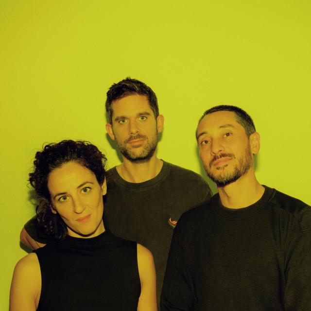 Another press image of the trio Eden Loriot Tantanozi, with yellow backgound