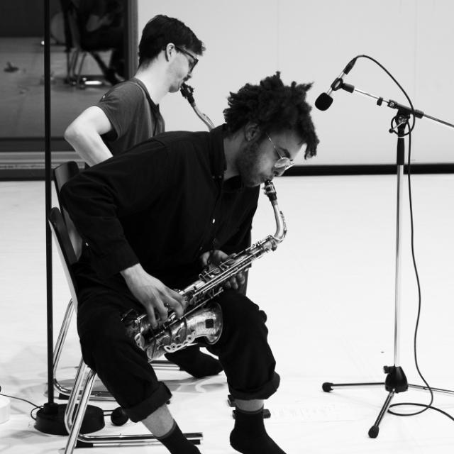 Tapiwa Svosve and Tobias Pfister playing the saxophone