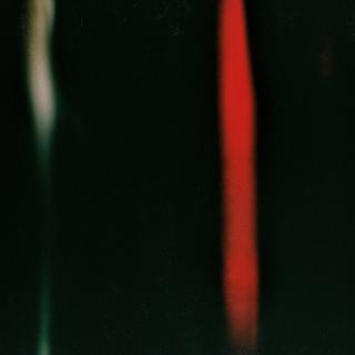 Cover artwork by Philipp Eden, black background with a whitish stripe to the left and a red stripe from up to down on the right